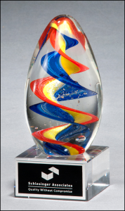 7 1/8" x 2 3/4" Glass egg-shaped award with spiraling colors inside. Includes a black with silver lettering plate personalized with text, image, or logo. Order Online or Call the Corporate Connection 800-523-2344