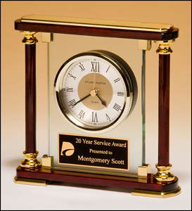 7" x7" Glass clock with rosewood and gold frame. Comes with a black brass and gold plate personalized with text image, or logo. Order Online or Call the Corporate Connection 800-523-2344