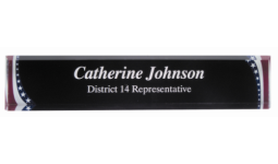 2" x 10" Acrylic desk nameplate with American flag patterns on the corners and white text in the center. Order Online or Call the Corporate Connection 800-523-2344