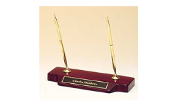 9" x 3.75" Rosewood award with black brass nameplate engraved with text, image, or logo.  Comes with two gold pens.  Order Online or Call the Corporate Connection 800-523-2344
