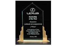 9 1/2" x 11 1/2" Clear jade acrylic engraved award with gold pillars base. Customize jade plate with text, image, or logo. Order Online or Ca;; the Corporate Connection 800-523-2344