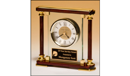 7" x7" Glass clock with rosewood and gold frame. Comes with a black brass and gold plate personalized with text image, or logo. Order Online or Call the Corporate Connection 800-523-2344